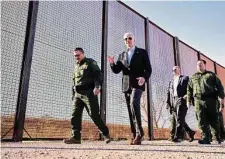  ?? Doug Mills/ New York Times ?? President Joe Biden tours the border in El Paso. His plan would create penalties for migrants without an asylum appointmen­t.