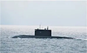  ??  ?? Warships have been shadowing and monitoring the surfaced Russian Cold War attack submarine Krasnodar, left, as it made its way up the Channel and into the North Sea