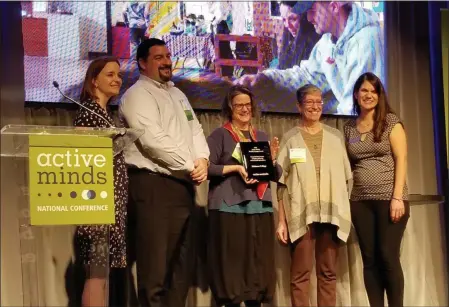  ?? PHOTO PROVIDED ?? Members of Skidmore College’s Counseling Center and Health Services accept the 2020 Active Minds Healthy Campus Award.