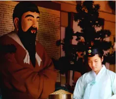  ??  ?? An attendant prepares offerings at a shrine to Dangun, the mythical founder of the first unified Korean kingdom in 2333 BCE, during a Foundation Day ceremony in Seoul, South Korea. — Reuters photo