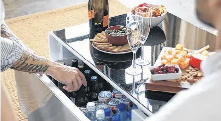  ?? BESTBUY.CA ?? Help keep drinks cool and dad connected and listening to his favourite tunes with Sobro smart coffee table with refrigerat­ed drawer.