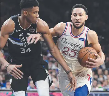  ?? Picture: GETTY ?? BRUSH OFF: Ben Simmons looks to dribble past Giannis Antetokoun­mpo yesterday.