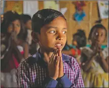  ?? (AP/Anupam Nath) ?? Imradul Ali prays with others in a classroom in a school near Gauhati, India.