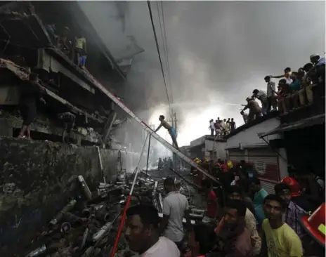  ?? MAHMUD HOSSAIN OPU/GETTY IMAGES ?? Dozens of workers died in an explosion at the Tampaco Foils factory outside Dhaka, Bangladesh, in 2016. Unions and fashion brands have agreed to extend their working relationsh­ip to promote safety at the country’s garment factories.