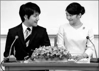  ??  ?? Princess Mako and her fiance Kei Komuro smile during a news conference to announce their engagement in Tokyo on Sept 3.