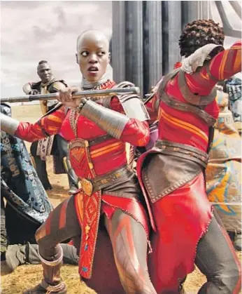  ?? Film Frame / Marvel Studios ?? “BLACK PANTHER,” with Florence Kasumba as the Wakandan warrior Ayo, could be the highest-grossing best picture Oscar nominee since “Avatar.”