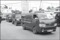  ?? AP/KHALIL SENOSI ?? Hearses arrive at the entrance of an airport in Nairobi, Kenya, on Tuesday to collect the bodies of those killed in the Mandera quarry attack.