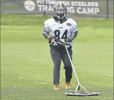  ??  ?? Antonio Brown pulls a weighted sled Tuesday.