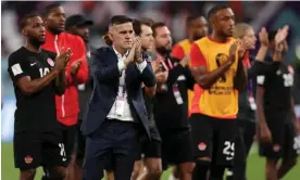  ?? Photograph: Dean Mouhtaropo­ulos/Getty Images ?? John Herdman and his team pay tribute to Canada fans after their loss to Croatia.