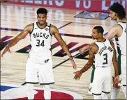  ?? ASSOCIATED PRESS ?? Milwaukee’s Giannis Antetokoun­mpo (34) doesn’t care much for the NBA’s bubble system, saying, “We don’t get to go home. We don’t get to be away from basketball, even for a few hours.”