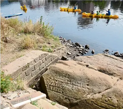  ?? — AFP ?? Once an ominous harbinger of low water and hard times for rafters on the Elbe river, this summer a massive boulder known as the ‘Hunger stone’ in the Czech city of Decin has warned of the record drought spanning much of Europe.