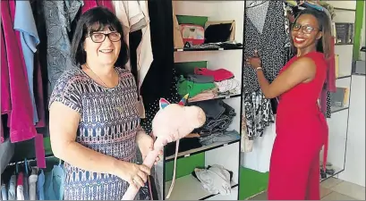  ?? Picture: BARBARA HOLLANDS ?? AFFORDABLE SHOPPING: Christelik­e Maatskapli­ke Raad (CMR) manager Gaye Moonieya, and the organisati­on’s marketer, Nwabisa Dlabati, unpack second-hand donations to stock the new Out of the Box charity shop in Old Transkei Road, Nahoon, which will help...