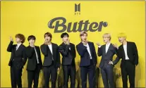  ?? THE ASSOCIATED PRESS ?? Members of South Korean K-pop band BTS, from left, V, Suga, Jin, Jung Kook, RM, Jimin and j-hope, pose for photograph­ers ahead of a press conference to introduce their new single “Butter” in Seoul, South Korea, on May 21.