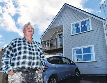  ?? PHOTO:GREGOR RICHARDSON ?? Building value . . . Otago Property Investors Associatio­n president Cliff Seque at his new 10month old Dundas St rentals, of two units with three bedrooms each, worth at least $600,000.