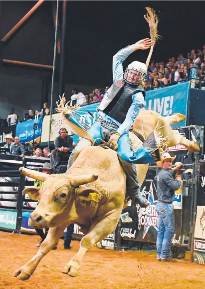  ?? WILD RIDE: Aaron Kleier on Buckanere during PBR Australia’s Iron Cowboy II event in Townsville. ??