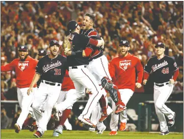  ?? AP/Patrick Semansky ?? Washington Nationals’ Yan Gomes and Daniel Hudson celebrate Tuesday after Game 4 of the National League Championsh­ip Series in Washington. The Nationals won 7-4 to win the series 4-0.