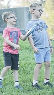  ??  ?? Ashton Stafford and big brother Max Stafford from Warragul enjoy a game frisbee at Burke Street park.