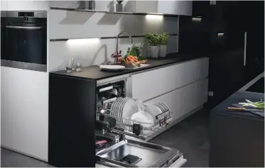  ??  ?? ComfortLif­t by AEG is the first dishwasher to gently lift the base to a comfortabl­e working height