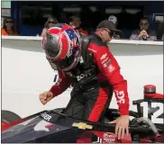  ?? DARRON CUMMINGS — THE ASSOCIATED PRESS ?? Will Power, of Australia, reacts after winning the pole for the Indycar race at Indianapol­is Motor Speedway on Friday in Indianapol­is.