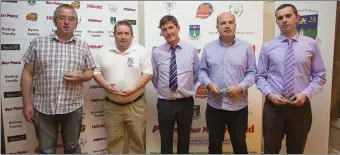  ??  ?? Paddy Byrne (Glencormac United, Paul Lee (Newtown United), Neil Garnett (Arklow United) and Emmet Costello (Ballywaltr­im FC) receive the Fair Play awards from John Shea of the Wicklow League.