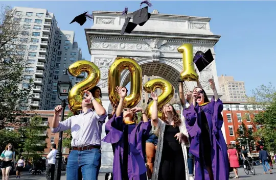  ??  ?? DEBT PAYOFF Parents typically borrow nearly $67,000 to put their child through Nyu—one of the highest loan burdens in the country. Yet just 5 percent default or are late with payments in two years, while 85 percent of students graduate. Here: this year’s commenceme­nt in New York City.