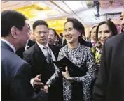  ?? Ore Huiying Getty Images ?? MYANMAR leader Aung San Suu Kyi, third from left, attends a summit in Singapore. Her government plans to repatriate Rohingya who fled to Bangladesh.