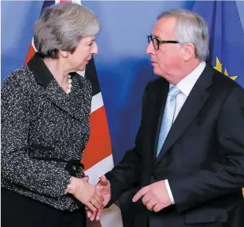  ?? PHOTO AFP ?? La première ministre britanniqu­e Theresa May s’est entretenue avec le président de la Commission européenne, Jean-claude Juncker, hier, à Bruxelles.