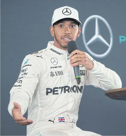  ??  ?? Mercedes driver Lewis Hamilton speaks during a launch event for Mercedes’ 2017 Formula One car.