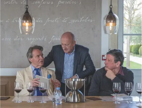  ??  ?? Above: Spurrier with Hervé Berland, CEO of Château Montrose, St-Estèphe and Stephen Brook (right) at a tasting during Bordeaux en primeur week in 2016