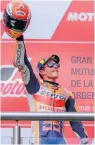  ??  ?? Marquez on the podium after his win