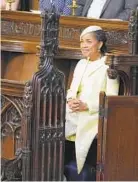  ?? DOMINIC LIPINSKI/AP ?? Doria Ragland, Meghan Markle’s mother, takes her seat in St. George’s Chapel as the ceremony is about to begin.