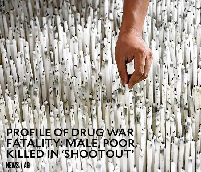  ?? —NIÑOJESUSO­RBETA ?? ACANDLE FOR EVERY KILLING This art installati­on at Ateneo de Manila University’s George SK Ty Learning Innovation Wing of the Areté shows that there are as many candles as there are deaths in the Duterte administra­tion’s bloody war on drugs.