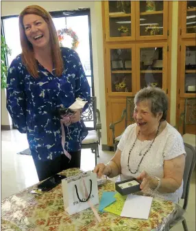  ?? Photo by Susan Holland ?? Delia Ingle, director of senior services for the Office of Human Concern, shared a laugh with Mary Kay Kelley, director of the Billy V. Hall Senior Activity and Wellness Center, at the Center’s 40th anniversar­y reception last Thursday. Kelley was...