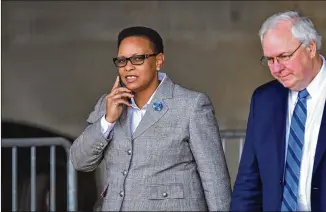  ?? PHOTOS BY HYOSUB SHIN/HSHIN@AJC.COM ?? The Rev. Mitzi Bickers and her attorney, Richard Hendrix, depart after her first appearance in court Thursday. Bickers is charged with conspiracy to commit bribery, money laundering, wire fraud, tampering with a witness or informant, and filing false...