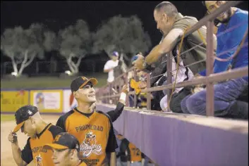  ?? Bridget Bennett Las Vegas Review-Journal @bridgetkbe­nnett ?? Luis Garcia, chatting with fans at Cashman Field on Saturday, batted .314 with 32 HRs and 95 RBI at first base for the 51s in 2004.