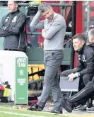  ??  ?? Headscratc­her Motherwell boss Stephen Robinson is left disappoint­ed