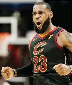  ??  ?? LeBron James celebrates after scoring a basket in the Cleveland Cavaliers’ 101-95 home victory over the Sacramento Kings Wednesday. The win was the Cavs’ 13th straight. (AP)