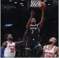  ?? FRANK FRANKLIN II — AP ?? The Nets’ Kevin Durant (7) shoots over the Knicks’ Julius Randle (30) and Evan Fournier (13) during the second half on Wednesday.