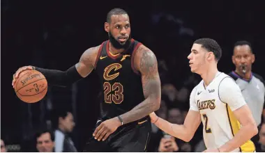  ?? GARY A. VASQUEZ/ USA TODAY SPORTS ?? After playing this past season against Lakers guard Lonzo Ball, next season LeBron James will be wearing the purple and gold.