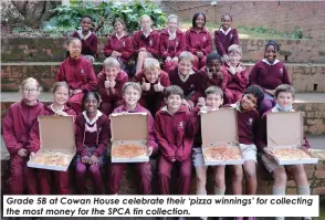  ?? ?? Grade 5B at Cowan House celebrate their ‘pizza winnings’ for collecting the most money for the SPCA tin collection.