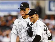  ?? Elsa / Getty Images ?? The Yankees’ Aaron Judge, left, and Anthony Rizzo react during Game 3 of the American League Championsh­ip Series.