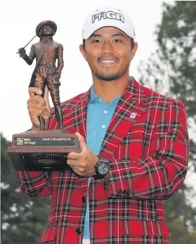  ?? Picture: AFP ?? SWEET WIN. Japan’s Satoshi Kodaira with the trophy after winning the Heritage at Harbour Town Golf Links on Sunday.