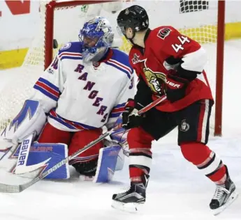  ?? FRED CHARTRAND/THE CANADIAN PRESS ?? Ottawa’s Jean-Gabriel Pageau beats Rangers netminder Henrik Lundqvist for his third goal of the game.