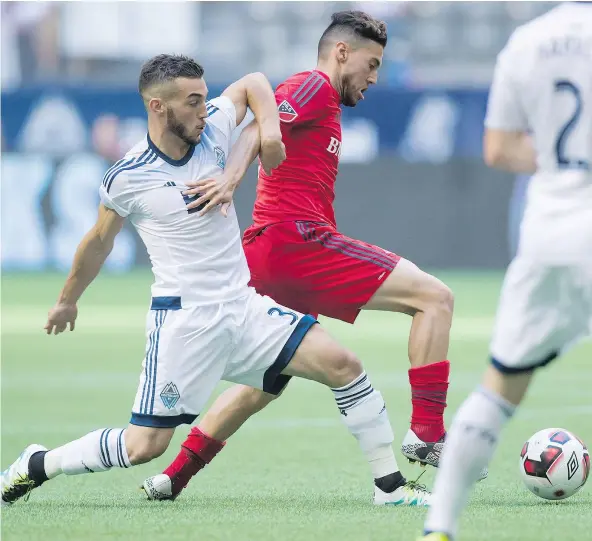 ?? — THE CANADIAN PRESS FILES ?? Vancouver Whitecaps midfielder Russell Teibert, left, says the team believes in its locker-room as it chases a Western Conference playoff spot with four of its next five MLS regular season games on the road.