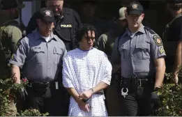  ?? MATT ROURKE — THE ASSOCIATED PRESS ?? Law enforcemen­t officers escort Danelo Cavalcante from a Pennsylvan­ia State Police barracks in Avondale Pa., on Wednesday.