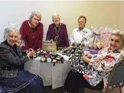  ??  ?? Preparing for the event are Holly Hall residents, from left, Julie Kennicott, Patti Gipson, Lucy Palomo, Dorothy Higgitt and Viola Pokluda.