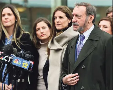  ?? Erik Trautmann / Hearst Connecticu­t Media file photo ?? Michelle Troconis, charged with conspiracy to commit murder in the disappeara­nce of Jennifer Dulos, exits the court following a pre-trial hearing with her family and attorney Jon L. Schoenhorn on Feb. 6, 2020.