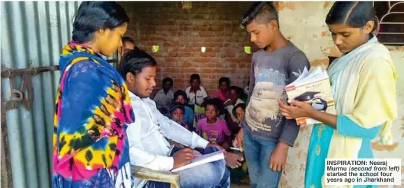  ??  ?? INSPIRATIO­N: Neeraj Murmu (second from left) started the school four years ago in Jharkhand