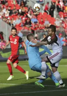  ?? RICHARD LAUTENS/TORONTO STAR ?? Toronto FC goalkeeper Clint Irwin takes a hit as he challenges Ottawa’s Sito Seoane who was on a breakaway on Wednesday at BMO Field.