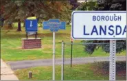  ?? PHOTO BY GEOFF PATTON ?? A new sign, left, has been built next to West Main Street in Lansdale near two exisitng signs in adjacent Towamencin Township welcoming motorists and pedestrian­s to the borough. Monday, September 29, 2014.